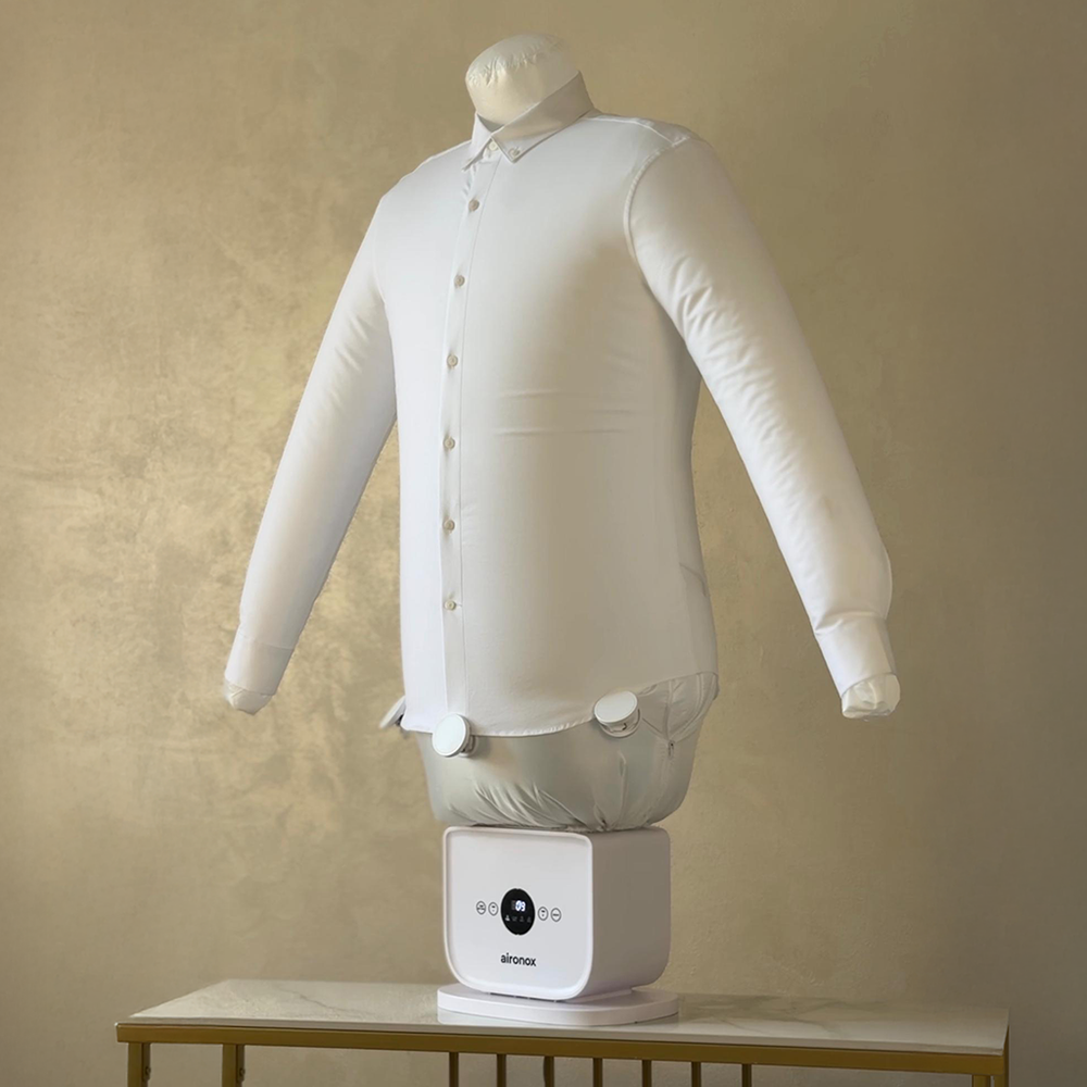 Aironox HOME supporting a white shirt on a console table